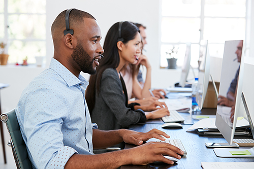 man and woman in call center